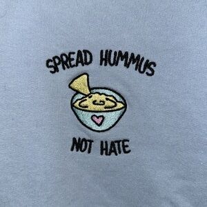 “Spread hummus not hate” crewneck sweatshirt